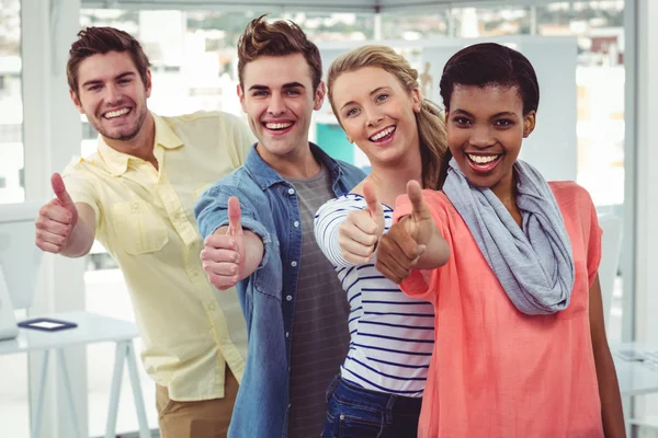 Smiling creative team standing in a line — Stock Photo, Image