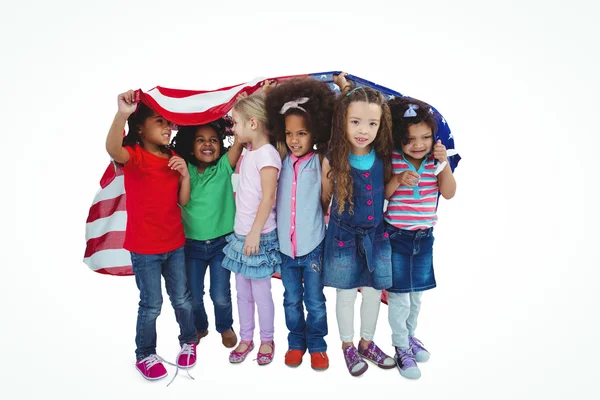 Girls standing with american flag overhead — Stock Photo, Image