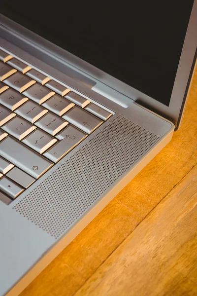 Laptop on wood desk — Stock Photo, Image