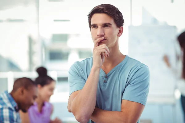 Young creative worker thinking — Stock Photo, Image