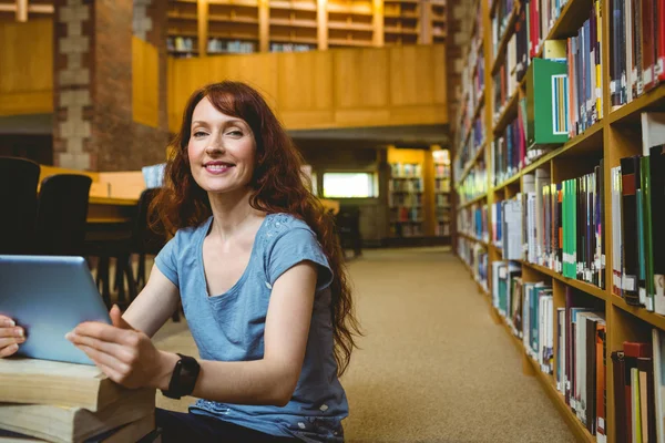 Mature student smiling in library Royalty Free Stock Images