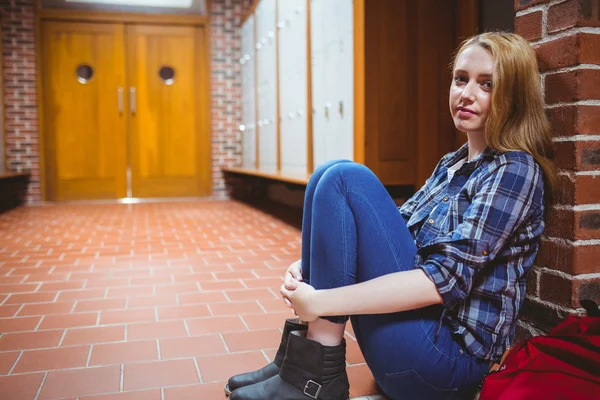 Thoughtful student sitting on the floor — Stock Photo, Image