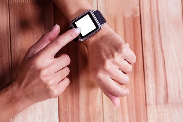 Part of hands typing on a watch — Stock Photo, Image