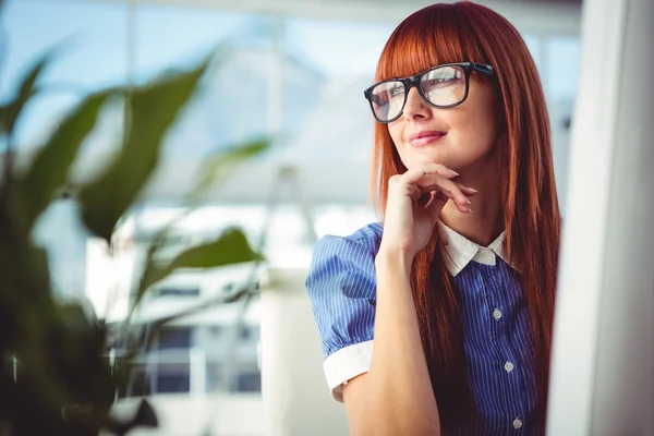 Attractive smiling hipster woman thinking — Stock Photo, Image