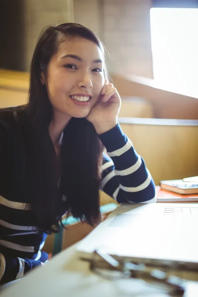 Smiling student in lecture hall — Stock Photo, Image