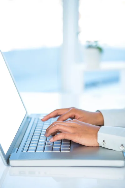 Cropped image of woman using laptop — Stock Photo, Image