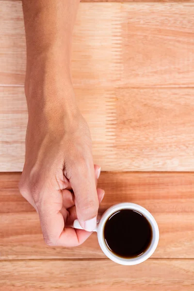 Woman hands holding cup of coffee — Stock Photo, Image