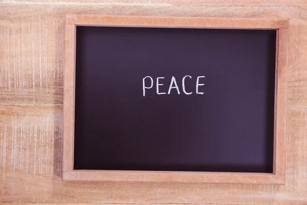 Chalkboard with peace text — Stock Photo, Image