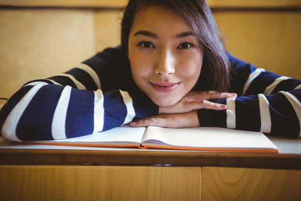 Smiling student in lecture hall — Stock Photo, Image