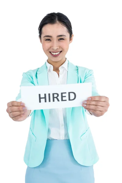 Businesswoman holding a signboard hired — Stock Photo, Image