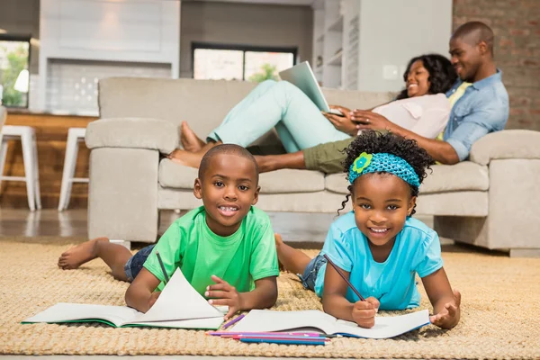 Happy siblings on the floor drawing — Stock Photo, Image