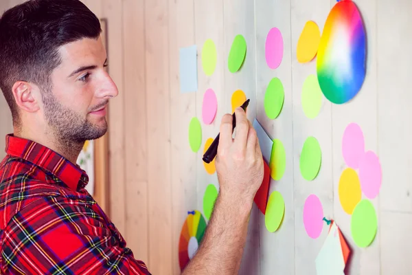 Creative worker using wall for brainstorm — Stock Photo, Image