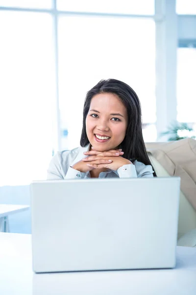 Smiling businesswoman at the desk — Stock Photo, Image