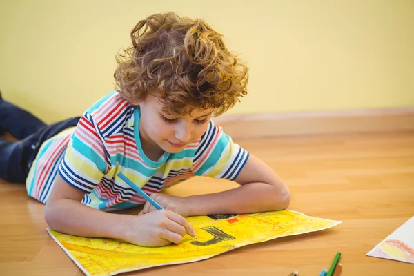 Boy lying on the ground — Stock Photo, Image