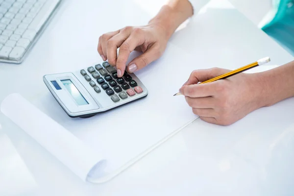 Smiling woman taking down notes — Stock Photo, Image