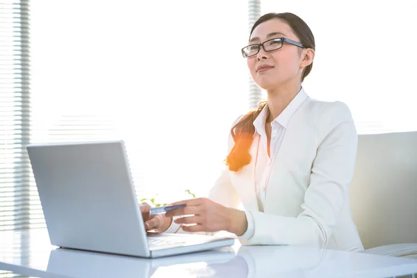 Smart businesswoman using her laptop — Stock Photo, Image