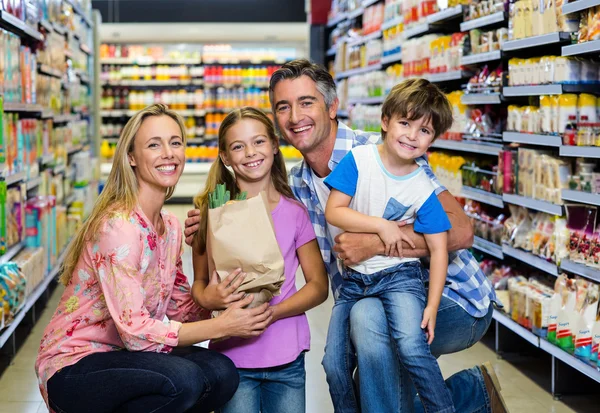 Happy family at the supermarket