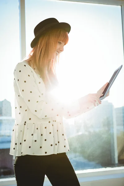 Smiling hipster woman using her tablet — Stock Photo, Image