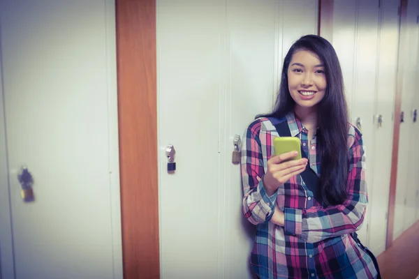 Cheerful student standing next the locker — Stock Photo, Image