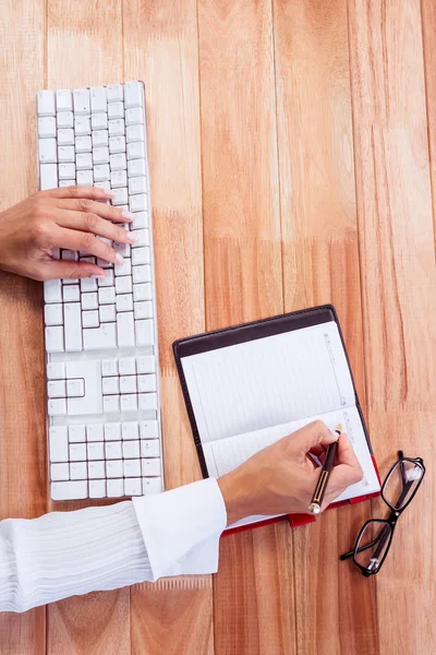 Part of hands typing on keyboard — Stock Photo, Image