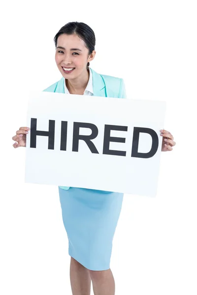 Businesswoman holding a signboard hired — Stock Photo, Image