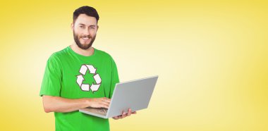 portrait of man working on laptop in office clipart