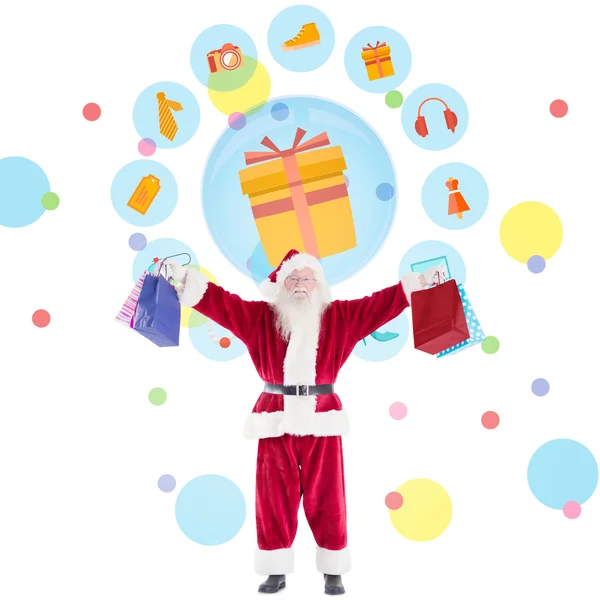 Composite image of santa carrying gifts — Stock Photo, Image