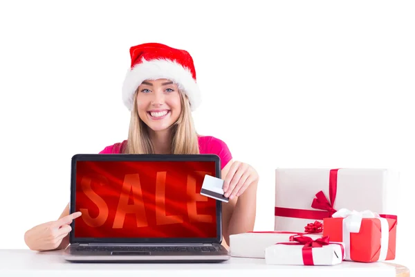 Festive blonde shopping online — Stock Photo, Image