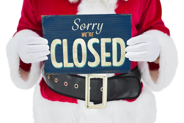 Mid section of santa claus holding page — Stock Photo, Image