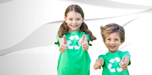 Siblings in green with thumbs up — Stock Photo, Image