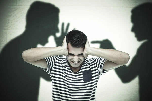 Frustrated man covering ears — Stock Photo, Image