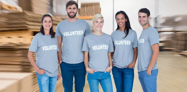 Volunteers friends smiling at camera — Stock Photo, Image
