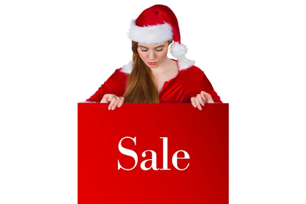 Girl in santa costume showing card — Stock Photo, Image