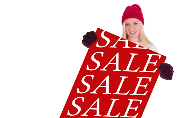 Festive blonde showing a blank banner — Stock Photo, Image