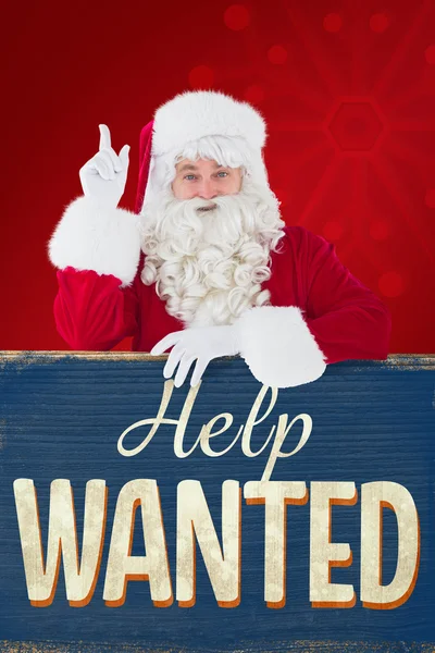 Composite image of smiling santa claus doing a gesture — Stock Photo, Image