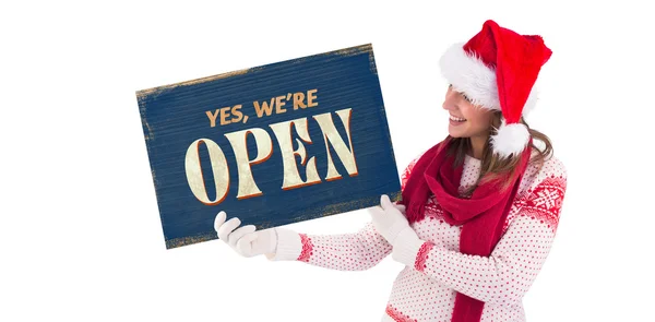 Festive brunette holding a poster — Stock Photo, Image