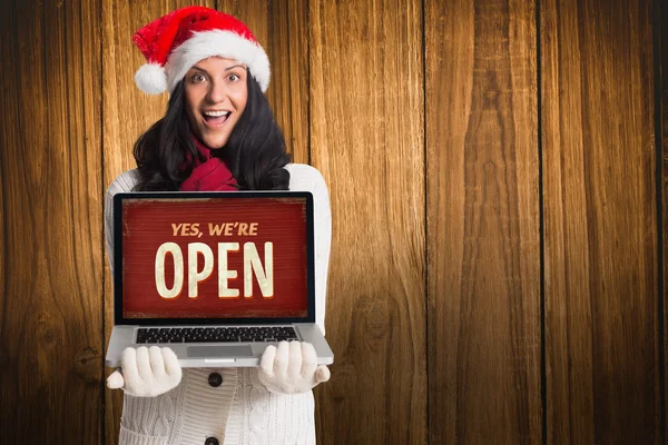 Smiling woman holding a laptop — Stock Photo, Image