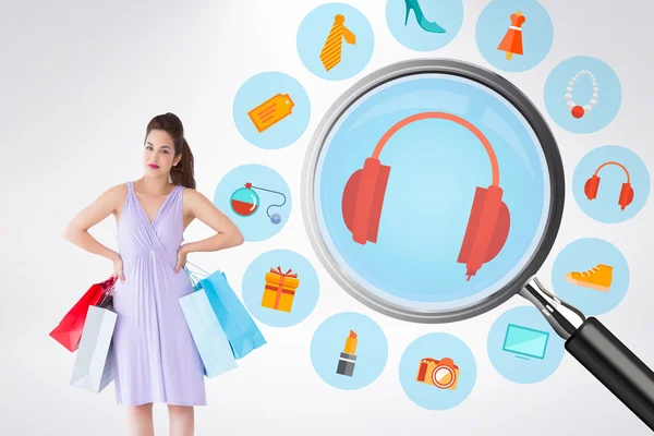 Elegant brunette with shopping bags — Stock Photo, Image