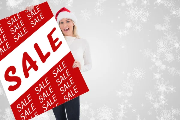 Festive blonde showing poster — Stock Photo, Image