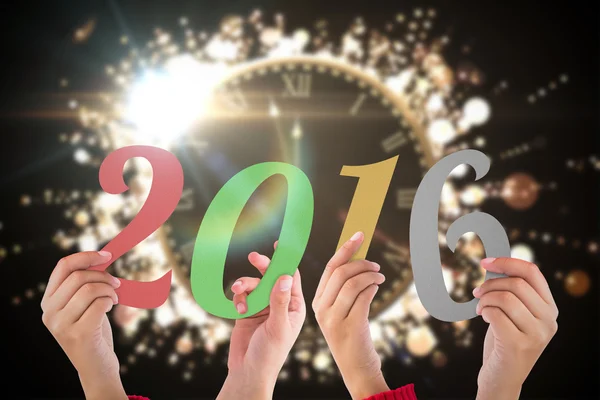 Imagem composta de mãos mostrando 2016 — Fotografia de Stock