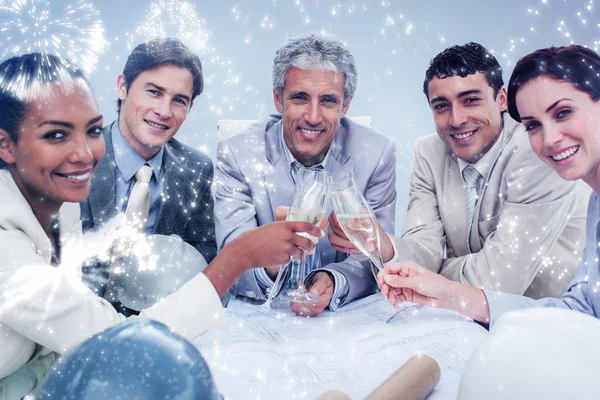 Smiling architectural team celebrating — Stock Photo, Image