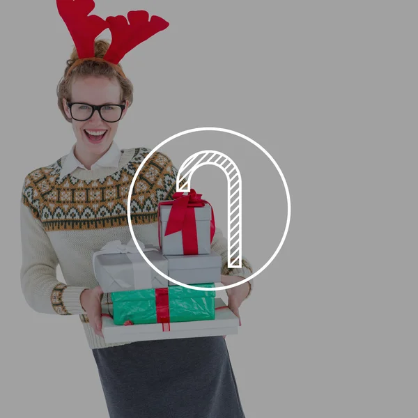 Happy geeky hipster holding presents — Stock Photo, Image
