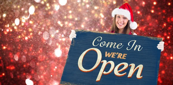 Festive blonde showing a blank banner — Stock Photo, Image