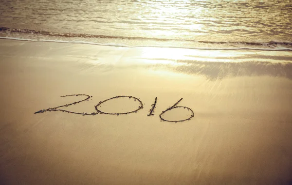 2016 on sand at beach — Stock Photo, Image