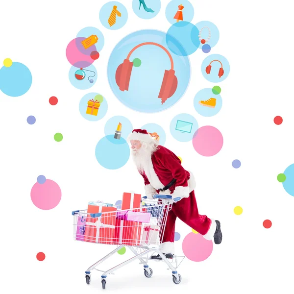 Zusammengesetztes Bild des Weihnachtsmannes, der einen Einkaufswagen schiebt — Stockfoto