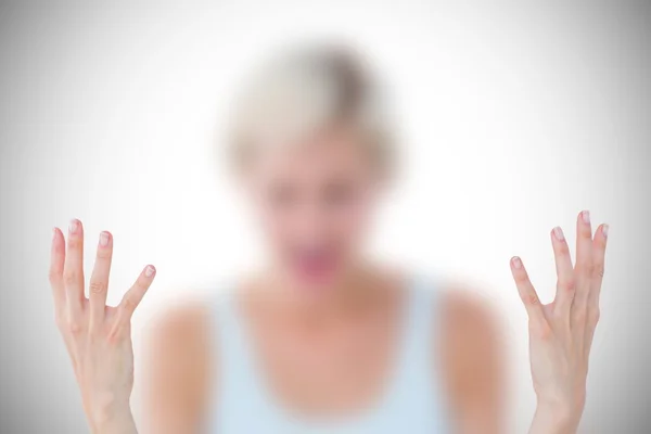 Angry blonde yelling with hands up — Stock Photo, Image