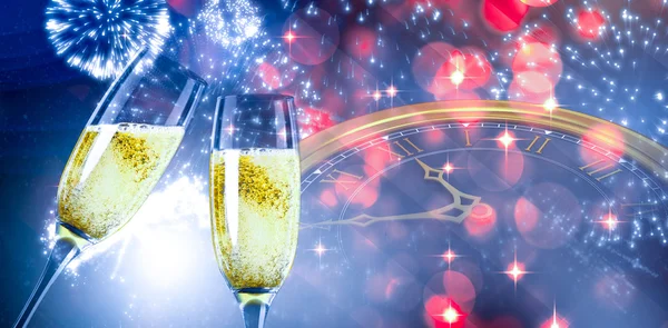 Composite image of champagne glasses clinking — Stock Photo, Image