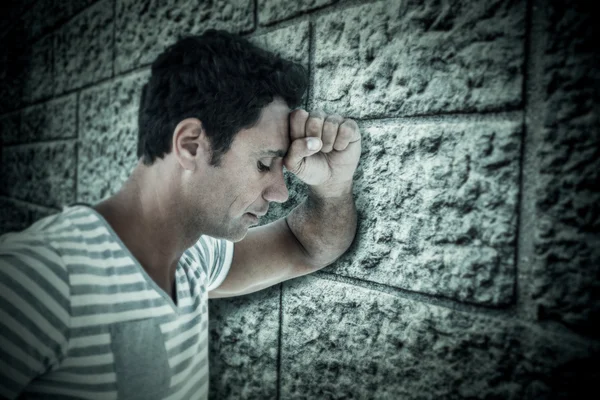 Upset man leaning on white background — Stock Photo, Image