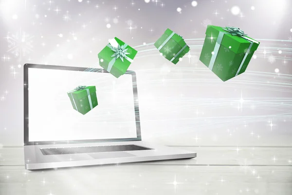 Green presenteert tegen laptop — Stockfoto