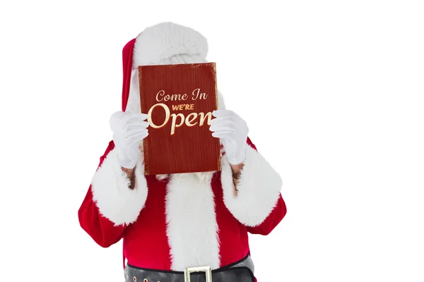 Composite image of santa claus presenting card — Stock Photo, Image